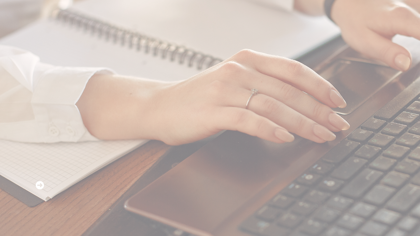 Woman typing at computer