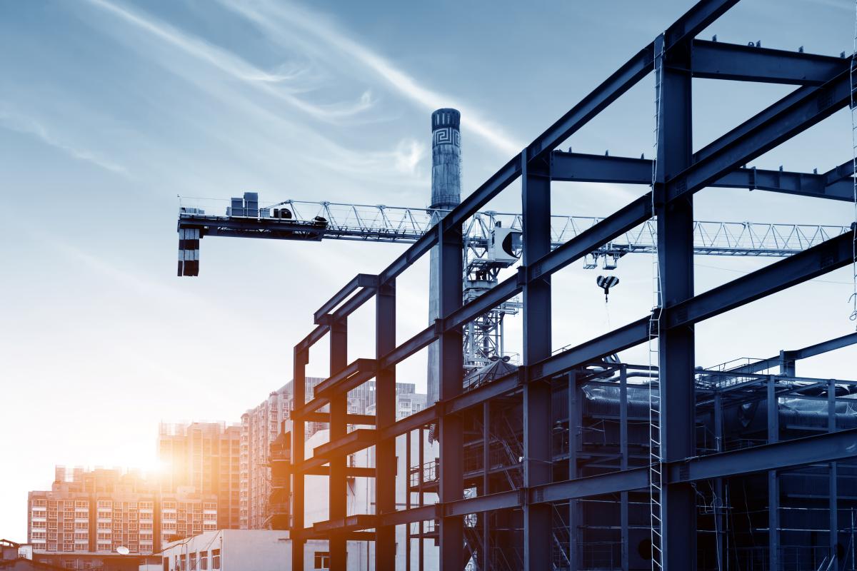 Photo of a building under construction at dusk