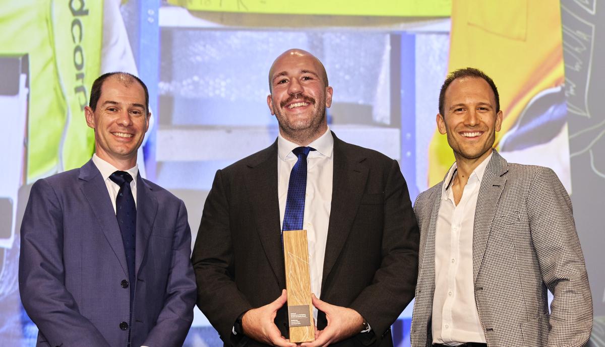 Photo of Federal Safety Commissioner David Denney with Jordan Sukkar and Nicolas Alvarez from Buildcorp at the 2022 Master Builders Awards