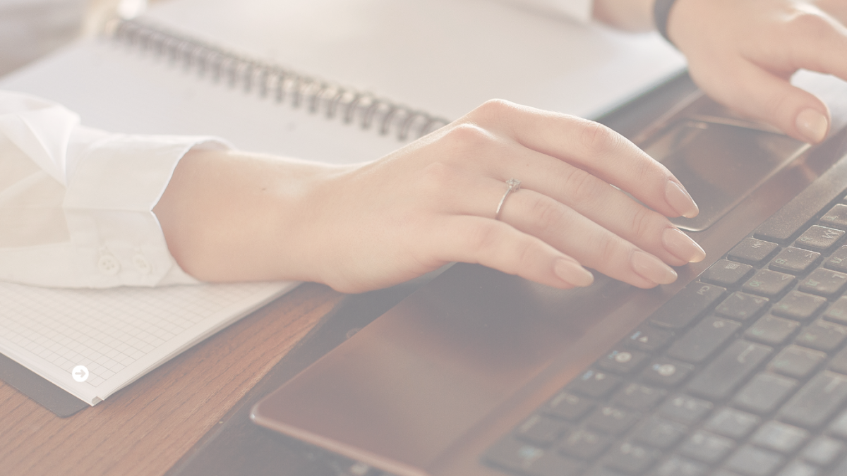 Woman typing at computer